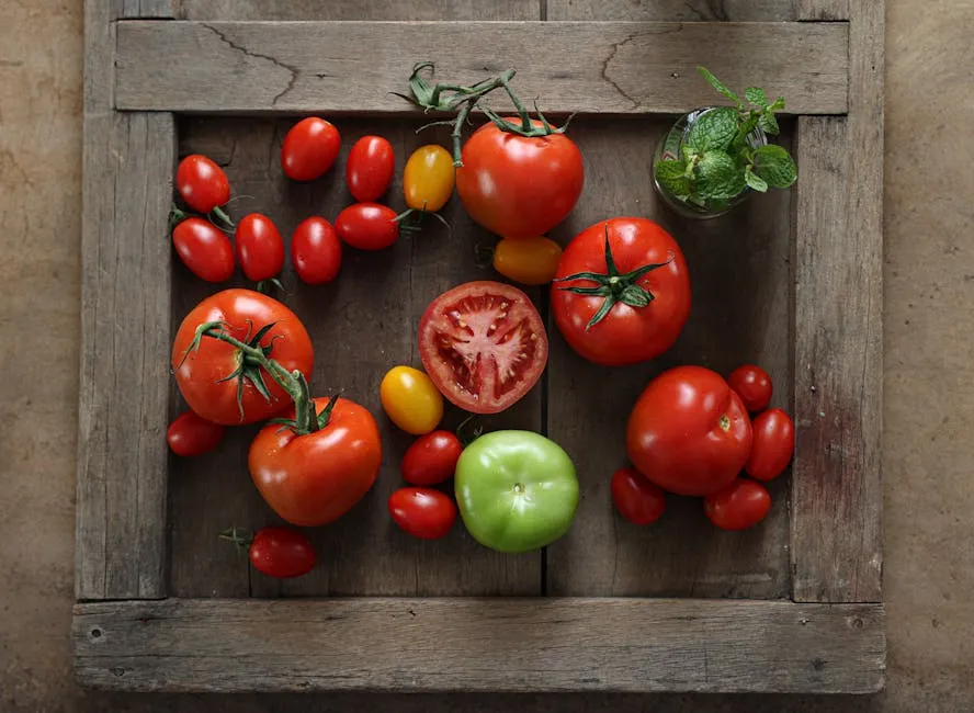 Multicolored Tomatoes Lying on a Wooden Tray