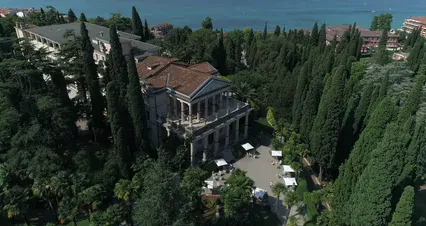 Horizontal video: Aerial view of a mansion surrounded by trees 8440741. Duration: 20 seconds. Resolution: 4096x2160