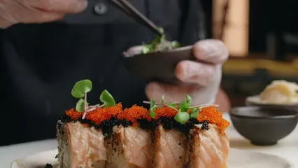 Horizontal video: A chef placing a garden cress leaves on seared sushi 8901901. Duration: 9 seconds. Resolution: 1920x1080