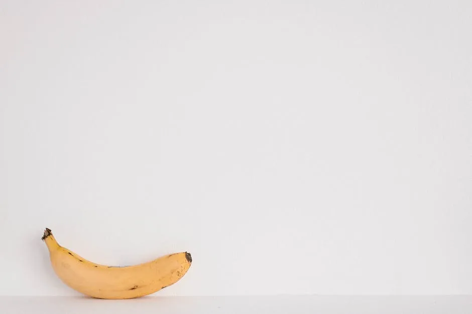 Yellow Banana Fruit on White Surface