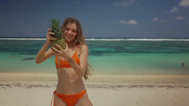 Horizontal video: Woman holding a pineapple 8306790. Duration: 12 seconds. Resolution: 1920x1080