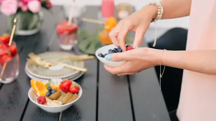 Horizontal video: A woman putting fresh fruits on a bowl 4762226. Duration: 13 seconds. Resolution: 1920x1080