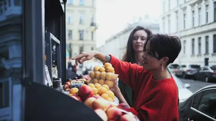 Horizontal video: Women buying fruits at the fruit stand 5705909. Duration: 37 seconds. Resolution: 3840x2160
