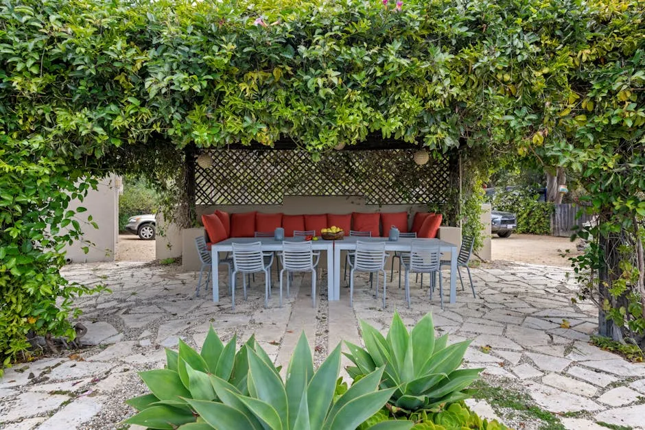Sofa, Chairs and a Table on the Patio in the Garden