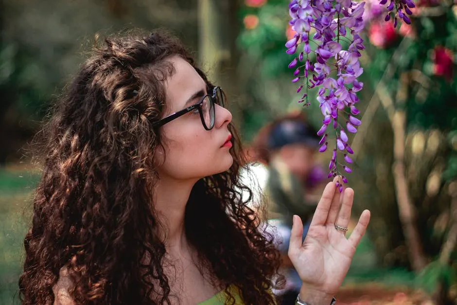 Woman Touching  Purple Flowers