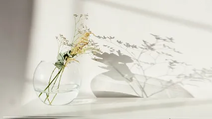 Horizontal video: Decorative flower in glass vase against white background 4884243. Duration: 12 seconds. Resolution: 3840x2160