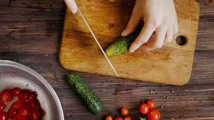 Horizontal video: A person slicing cucumbers by using a knife 5645024. Duration: 30 seconds. Resolution: 1920x1080