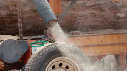 Horizontal video: Wood dust coming out from a hose 7165763. Duration: 18 seconds. Resolution: 3840x2160