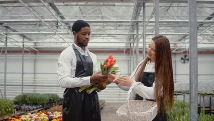 Horizontal video: Man and woman putting flowers in the basket 7101056. Duration: 36 seconds. Resolution: 3840x2160