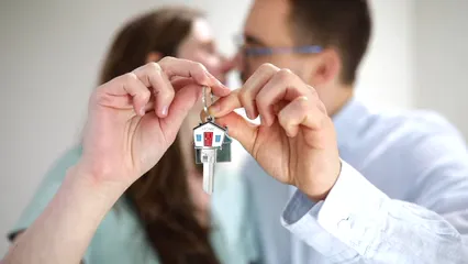 Horizontal video: A couple kissing while holding a house key 8293496. Duration: 10 seconds. Resolution: 1920x1080