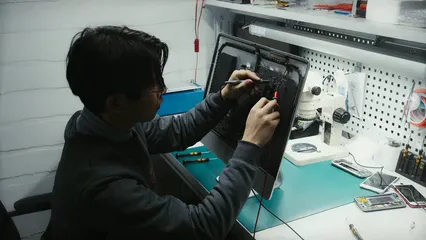 Horizontal video: A man fixing electronic gadgets 6755157. Duration: 18 seconds. Resolution: 3840x2160