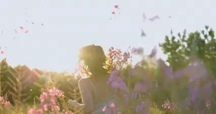 Horizontal video: A woman running on a field of flowers 9153882. Duration: 8 seconds. Resolution: 4096x2160