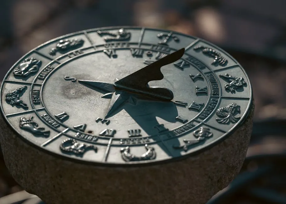 Detailed image of an antique sundial featuring zodiac symbols under natural light.