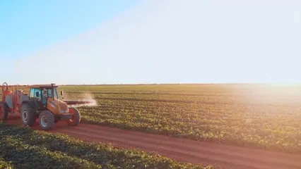 Horizontal video: Tractor watering crops 10744336. Duration: 13 seconds. Resolution: 1920x1080