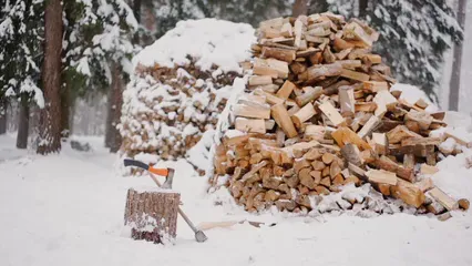 Horizontal video: A pile of wood in the snow with a snow shovel 6503171. Duration: 24 seconds. Resolution: 1920x1080