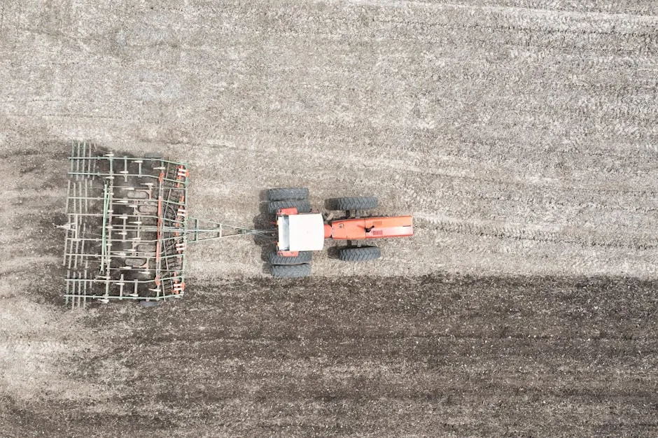 Top View of Tractor Plowing Field