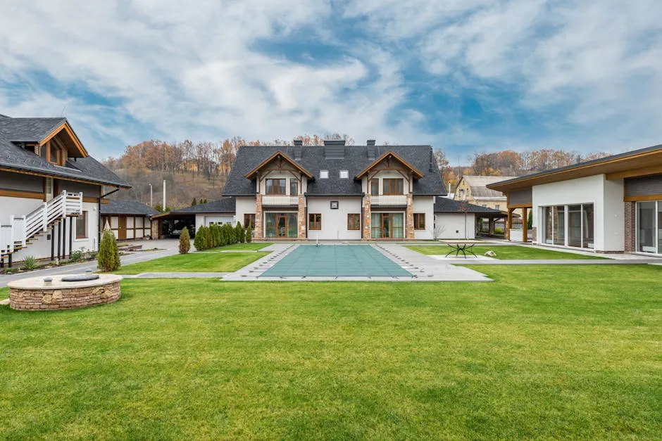 Exterior of contemporary residential cottage house with green lawn in yard under cloudy sky