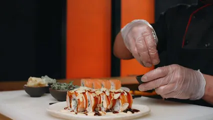 Horizontal video: A chef sprinkling sesame seeds on sushi 8901999. Duration: 15 seconds. Resolution: 1920x1080