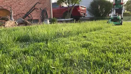 Horizontal video: Man mowing grass 12215822. Duration: 7 seconds. Resolution: 1920x1080