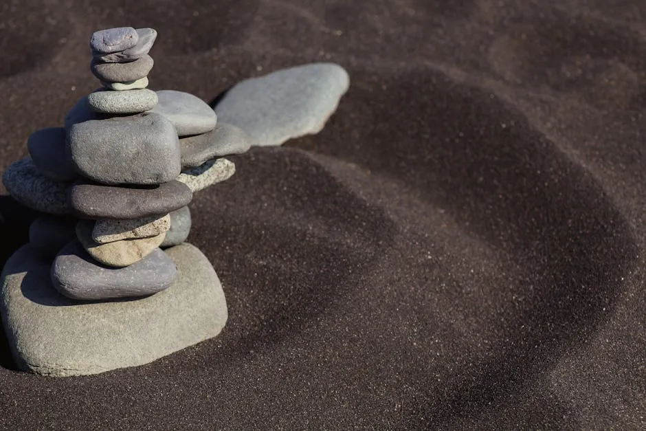 Photograph of a Stack of Stones on Sand